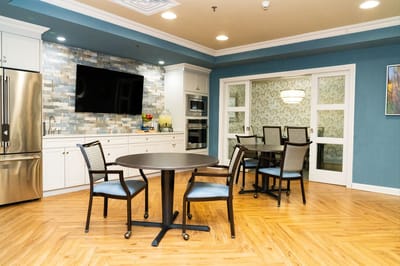 Common area with dining table and kitchen amenities