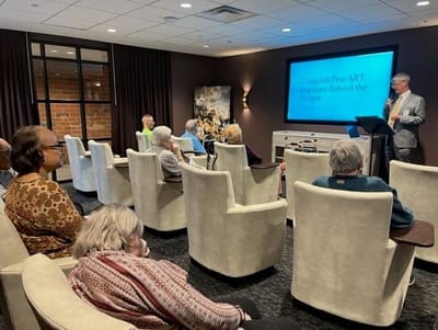 Residents attending an art presentation in a common area