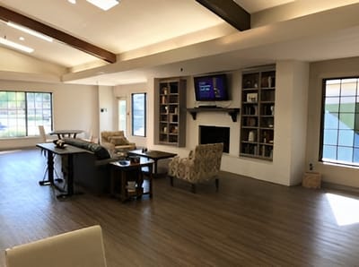 Bright common area with seating and shelves