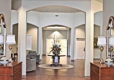 Interior view of a welcoming lobby with floral arrangement
