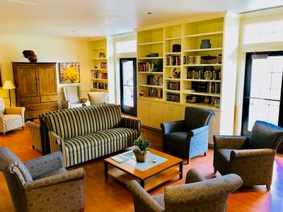 Common area with bookshelves and seating