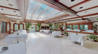 Bright dining room with tables and large windows