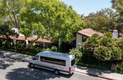 Exterior view of Mission Terrace with facility van