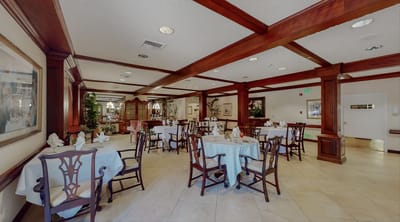 Dining area with neatly set tables and decor