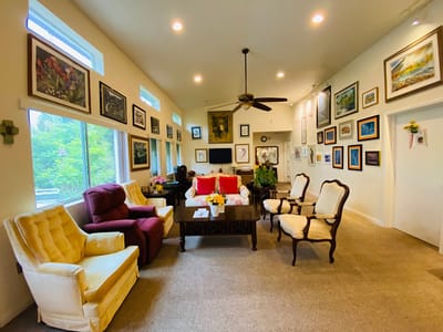 Bright common area with comfortable seating and artwork