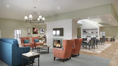 Bright common area with seating and fireplace