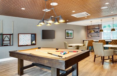 Common area with a pool table and seating