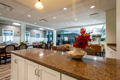Interior common area with a dining setup and flowers