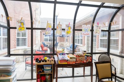 Activity area with crafts displayed on a clothesline
