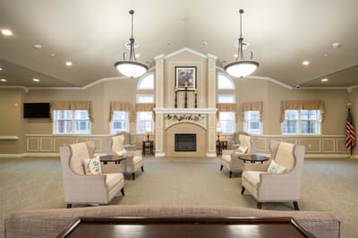 Interior common area with seating and a fireplace