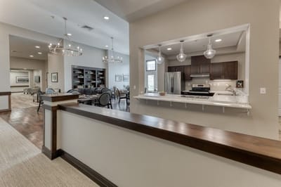 Bright common area with seating and open kitchen