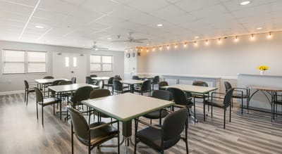 Interior view of a common area with seating and tables