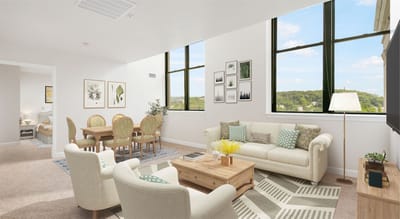 Bright common area with seating and dining space