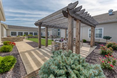 Outdoor patio area with seating and flowers
