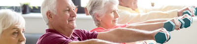 Residents participating in an exercise class with weights