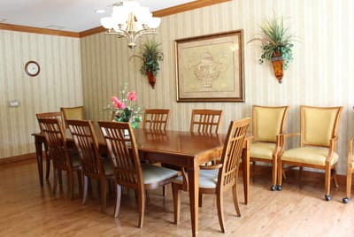 Interior dining room with wooden table and chairs