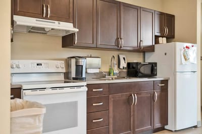 Kitchen area in a resident unit with modern appliances