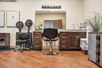 Bright salon area with styling chairs and mirrors