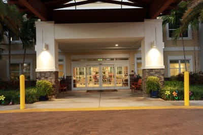Entrance to the facility with decorative plants