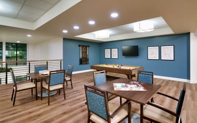 Common area in a bright interior with game tables