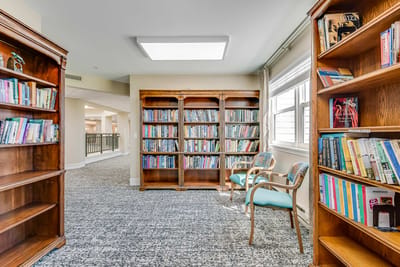 Cozy reading nook with bookshelves and seating