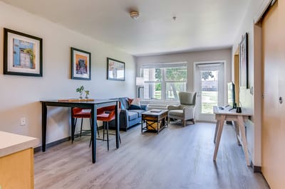 Cozy and well-decorated living room area in a senior living facility