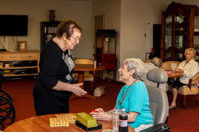 Residents enjoying a game of bingo in a common area