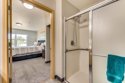 Interior view of a resident bathroom and bedroom