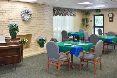 Dining area with tables and a piano