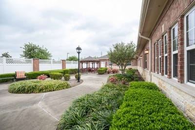 A landscaped outdoor space with pathways and seating