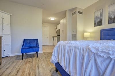 Cozy resident room with bed and seating area