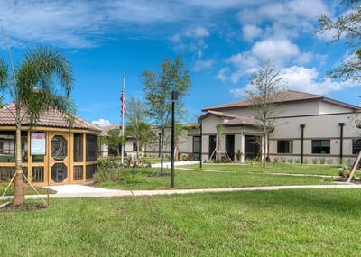 Exterior view of the facility with gardens and pathways