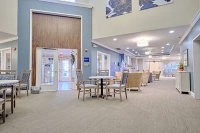 Bright common area with seating and tables