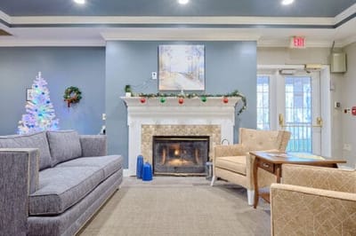 Cozy common area with festive decor and fireplace