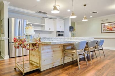 Bright kitchen area with seating and modern appliances