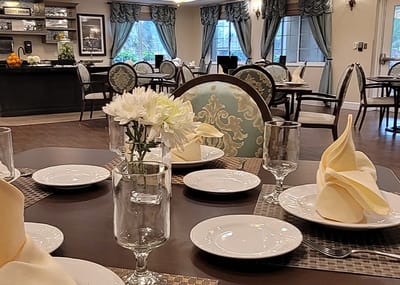 Elegant dining setup with flowers and tableware