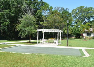 Outdoor patio area with seating and landscaping