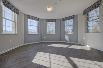 Bright interior room with large windows and views