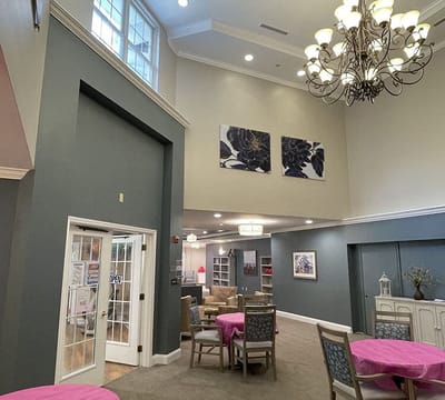 Bright common area with tables and decor