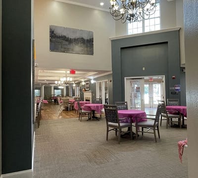 Interior view of a dining area with pink table settings