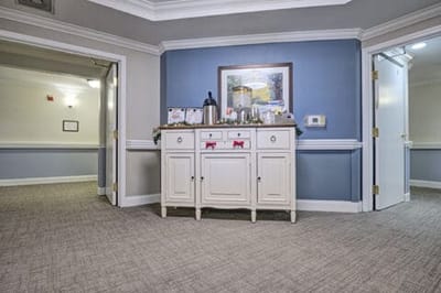 Interior hallway with a cabinet and artwork