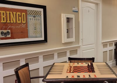 A chess board and bingo decoration in an activity room