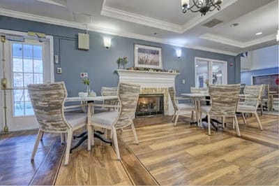 Dining area with tables and a fireplace