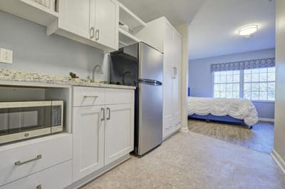 Interior view of a resident room with kitchenette