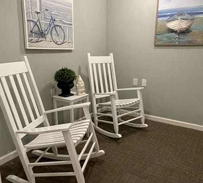 Two rocking chairs in a cozy common area