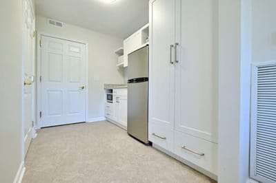Bright interior of a kitchen area in a resident room