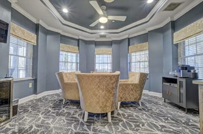 Common area with comfortable seating and large windows