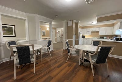 A cozy common area with tables and chairs