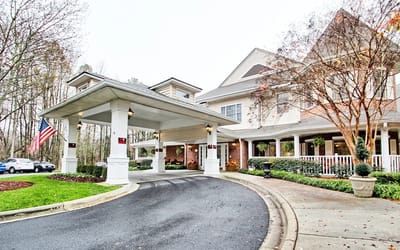 Entrance of the Charter Senior Living facility with a covered drive