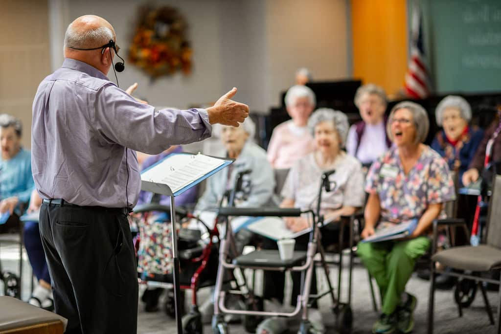 Residents enjoying a music activity in a common area